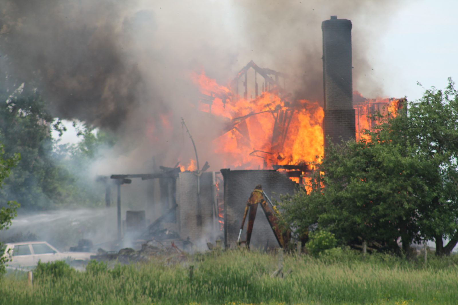 Compton farmhouse consumed by flames