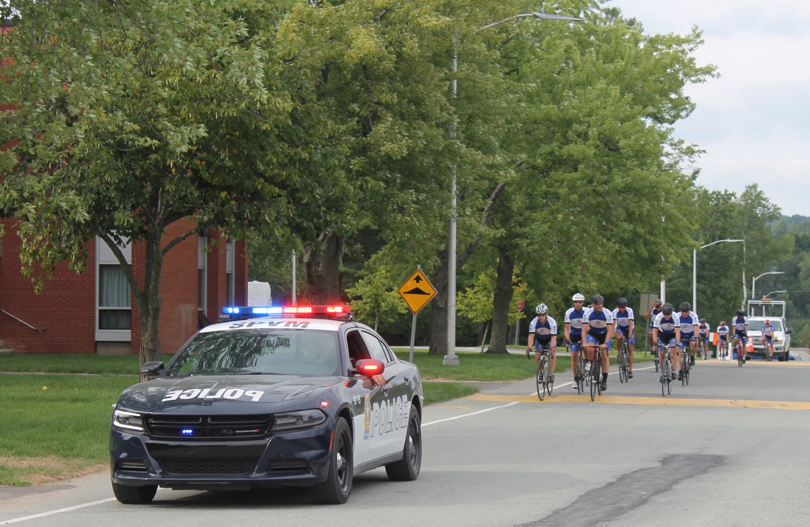 Montreal ­police bike through Lennoxville to raise funds for youth sports