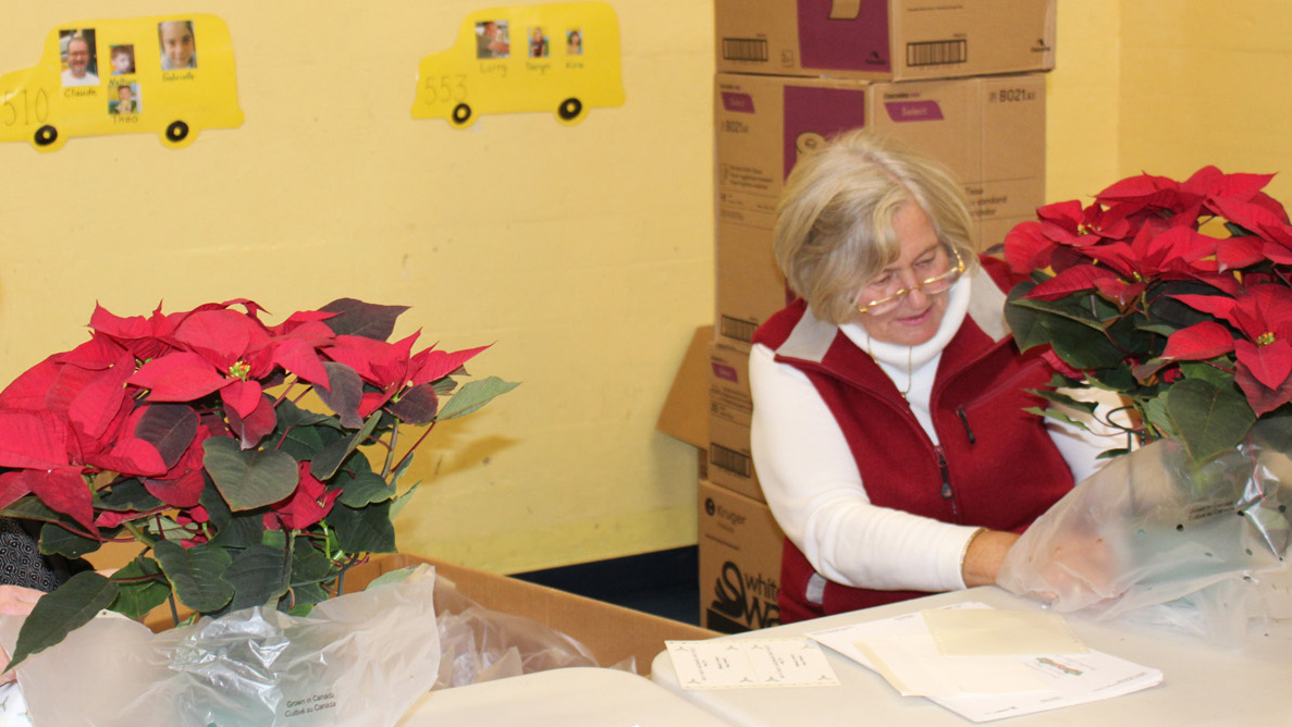 Lions Club and ­community volunteers prepare Christmas baskets