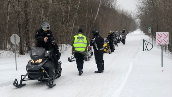 Police watching snowmobile trails