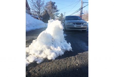 Sherbrooke snowbanks left to melt on their own