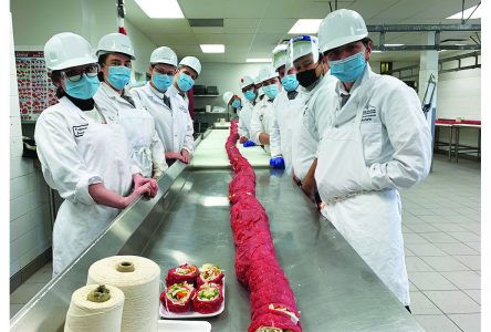 Vocational centre students break provincial record for longest meat rosette