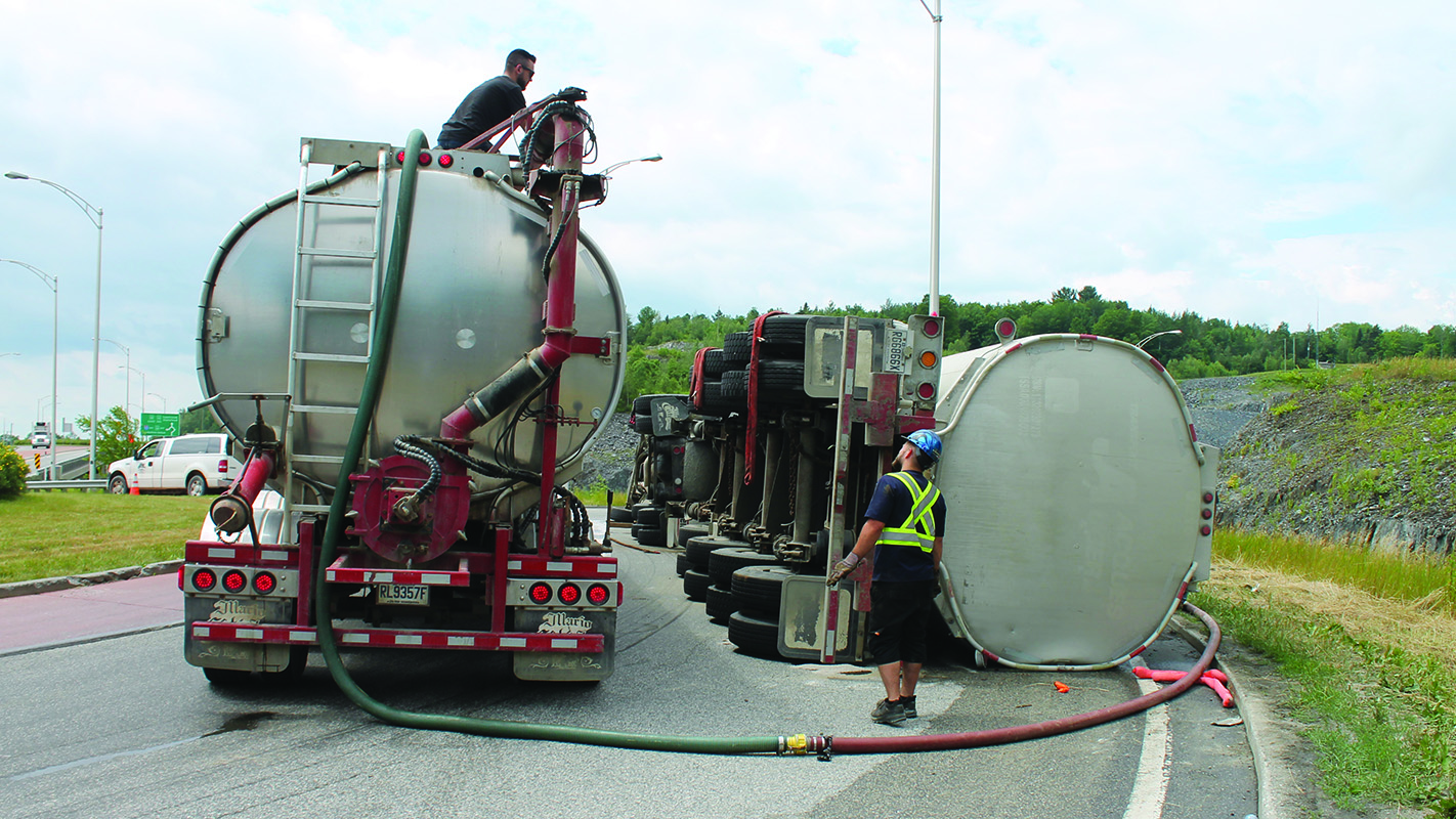 Milk truck turns over in Lennoxville roundabout