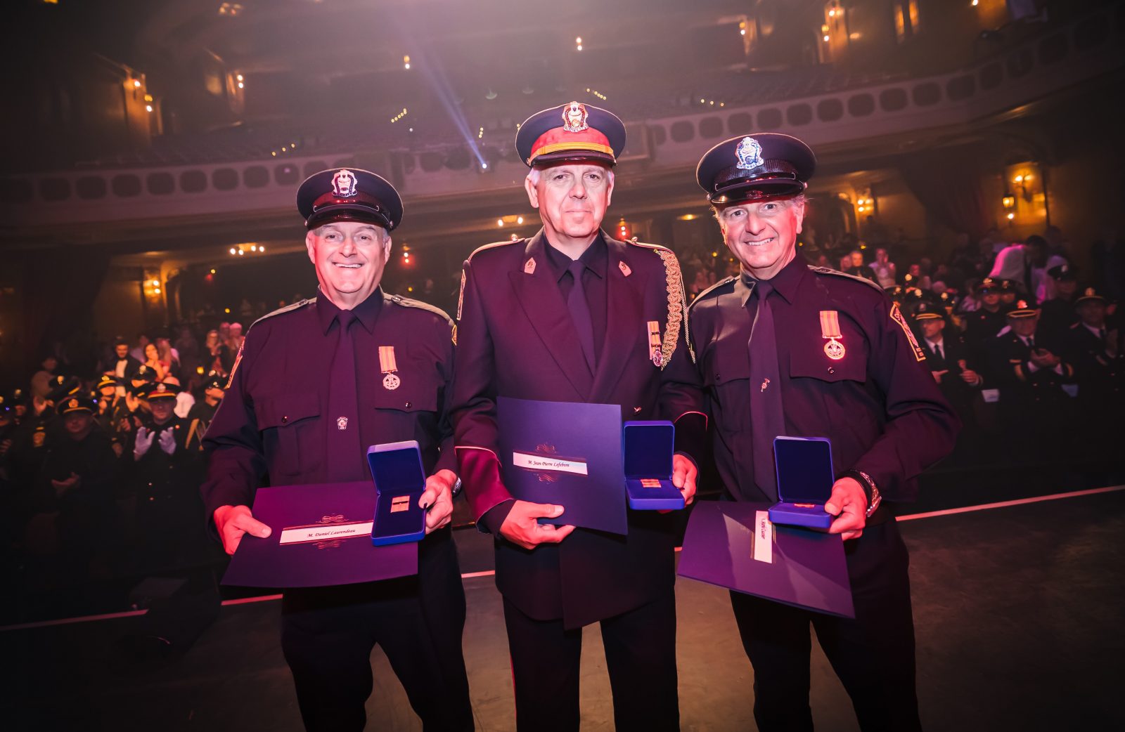 Firefighters honoured for years of service at Granada Theatre