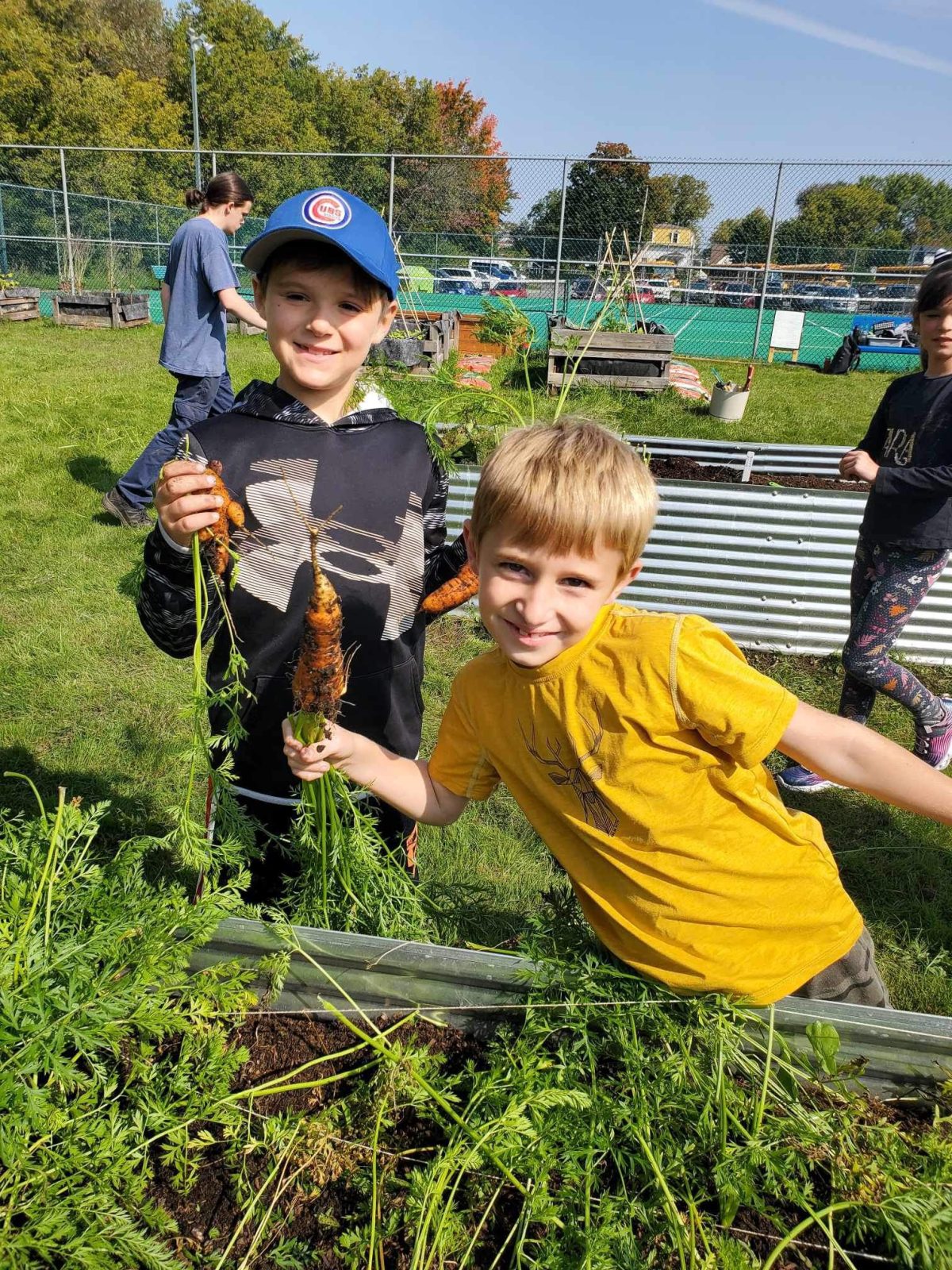 Princess Elizabeth Elementary celebrates community garden harvest, new sign