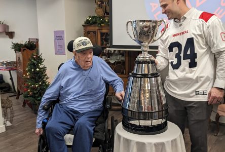 Gordon Ross holds the Grey Cup
